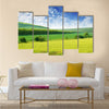 Green spring meadow and the beautiful blue sky Multi panel canvas wall art