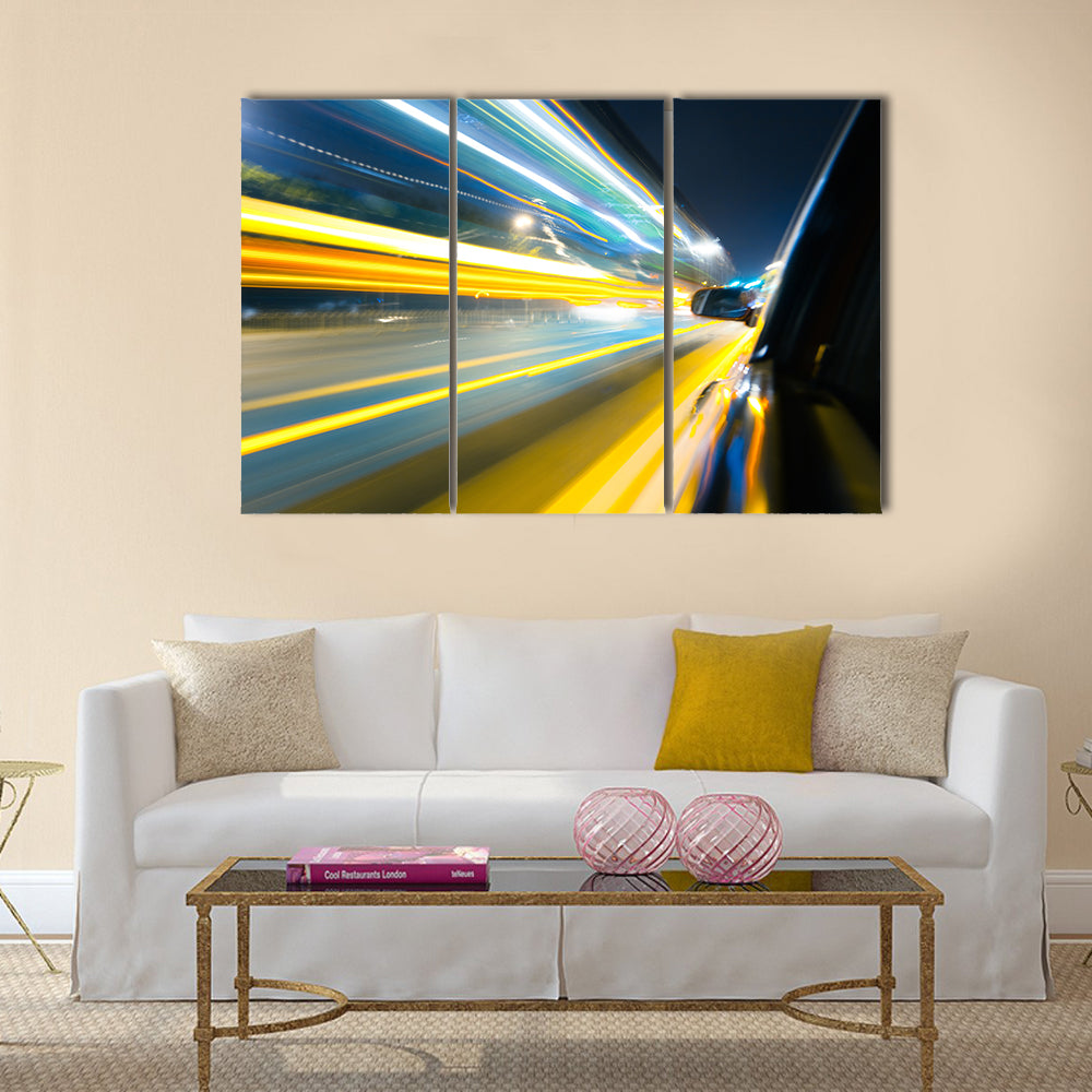 View from Side of Car Going Around Corner Multi Panel Canvas Wall Art