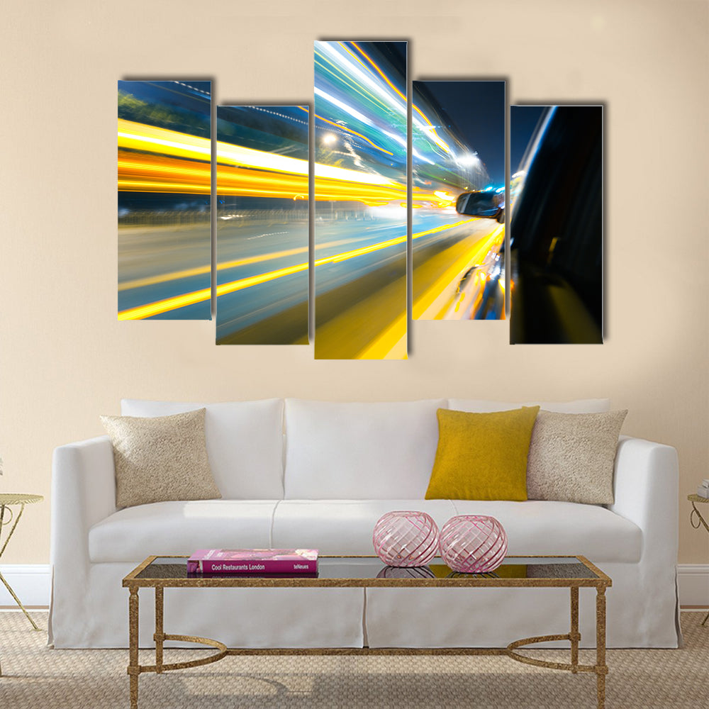 View from Side of Car Going Around Corner Multi Panel Canvas Wall Art