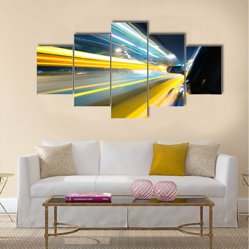 View from Side of Car Going Around Corner Multi Panel Canvas Wall Art