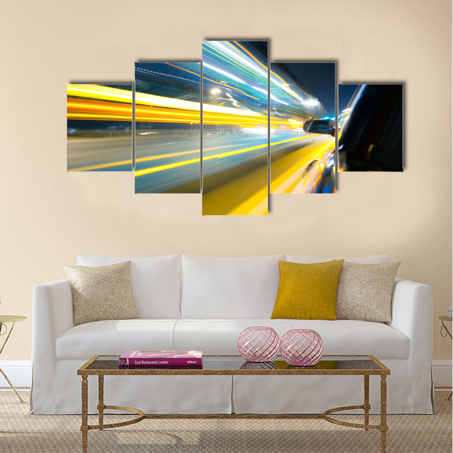 View from Side of Car Going Around Corner Multi Panel Canvas Wall Art