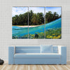 Beach, coconuts trees and school of fish in coral, Panama Multi panel canvas wall art