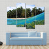 Beach, coconuts trees and school of fish in coral, Panama Multi panel canvas wall art