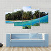 Beach, coconuts trees and school of fish in coral, Panama Multi panel canvas wall art