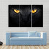 Muzzle a cat on a black background Multi panel canvas wall art