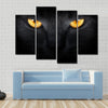 Muzzle a cat on a black background Multi panel canvas wall art