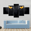 Muzzle a cat on a black background Multi panel canvas wall art