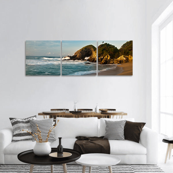 Sandy beach with rocks at sunrise Panoramic Canvas Wall Art