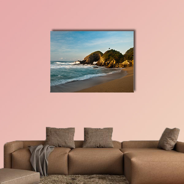 Sandy beach with rocks at sunrise multi panel canvas wall art