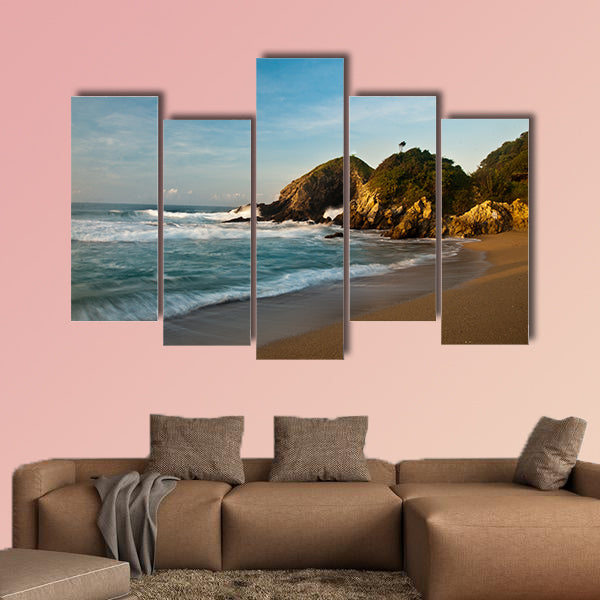 Sandy beach with rocks at sunrise multi panel canvas wall art