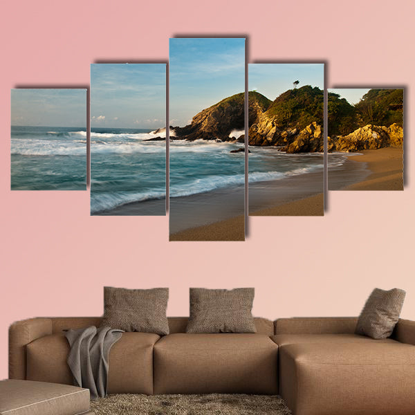 Sandy beach with rocks at sunrise multi panel canvas wall art