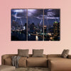 Lightning storm over city in purple light multi panel canvas wall art