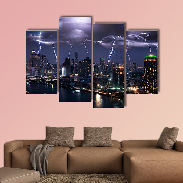 Lightning storm over city in purple light multi panel canvas wall art