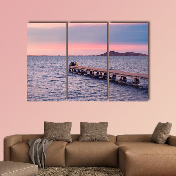  Friends enjoying sunset from a jetty on the Mar Menor wall art