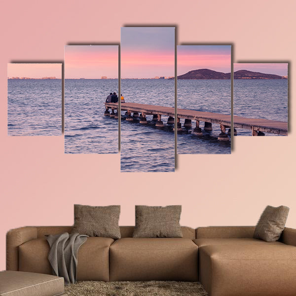  Friends enjoying sunset from a jetty on the Mar Menor wall art