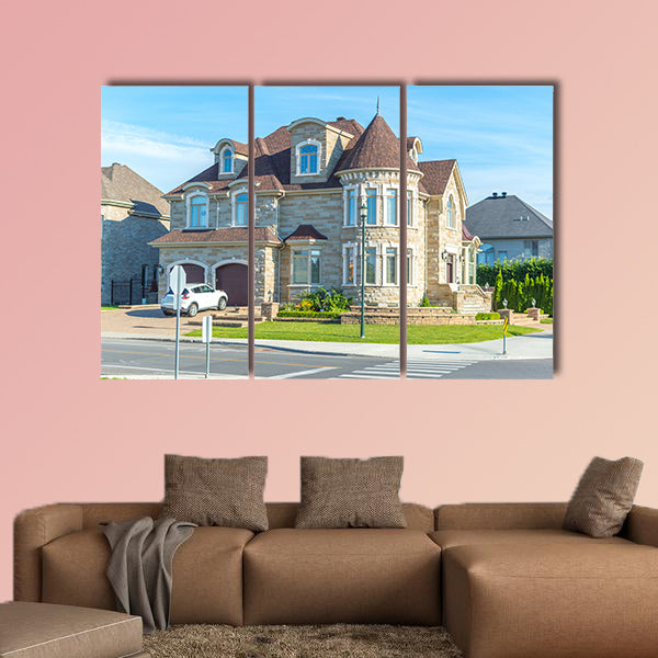 Luxury house in Montreal, Canada against blue sky multi panel canvas wall art