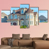 Luxury house in Montreal, Canada against blue sky multi panel canvas wall art