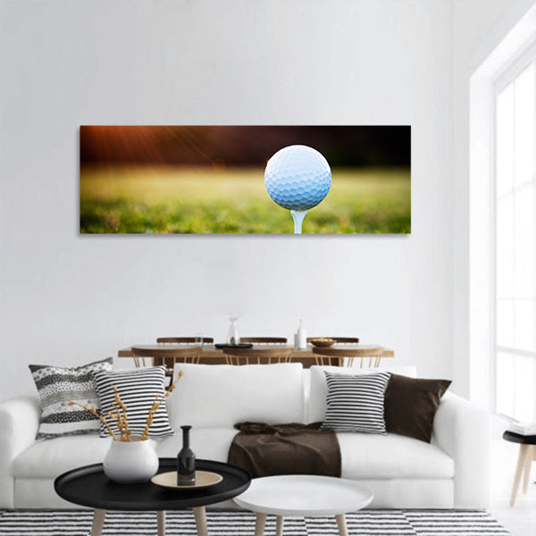 Close up of golf ball on tee panoramic canvas wall art
