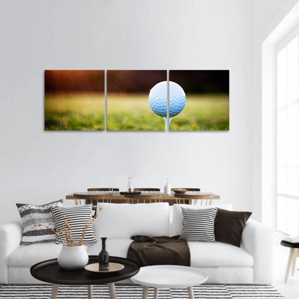 Close up of golf ball on tee panoramic canvas wall art