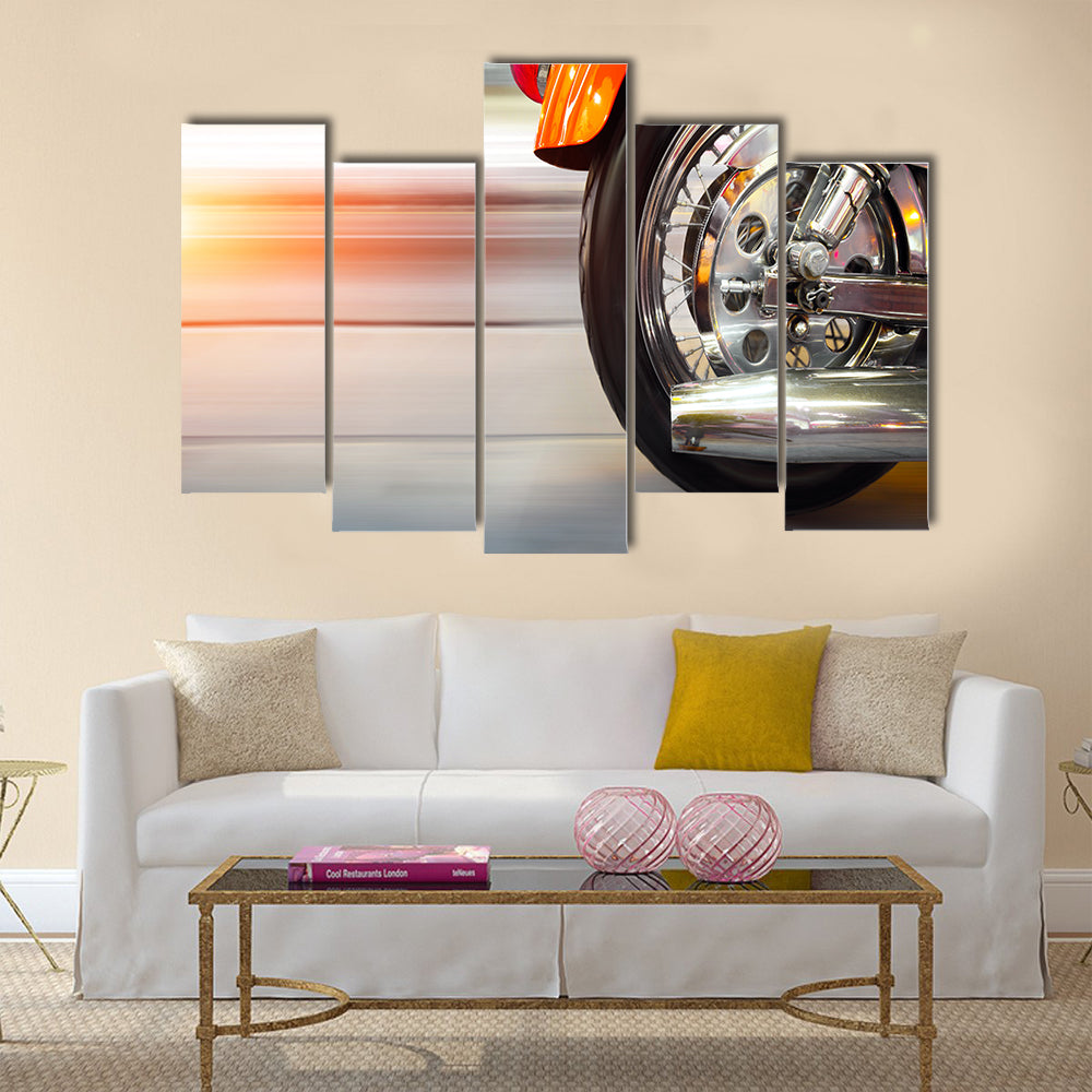 Part of a luxury motorcycle with blurry asphalt road Multi panel canvas wall art