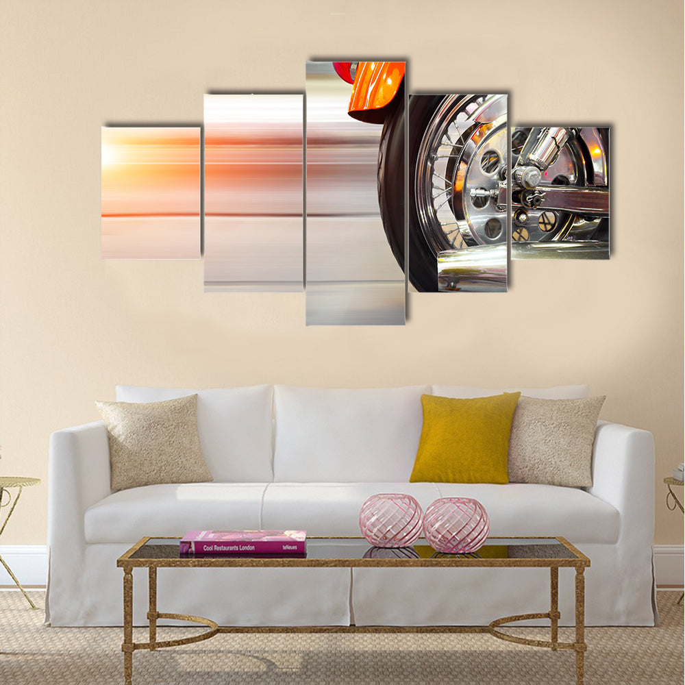 Part of a luxury motorcycle with blurry asphalt road Multi panel canvas wall art