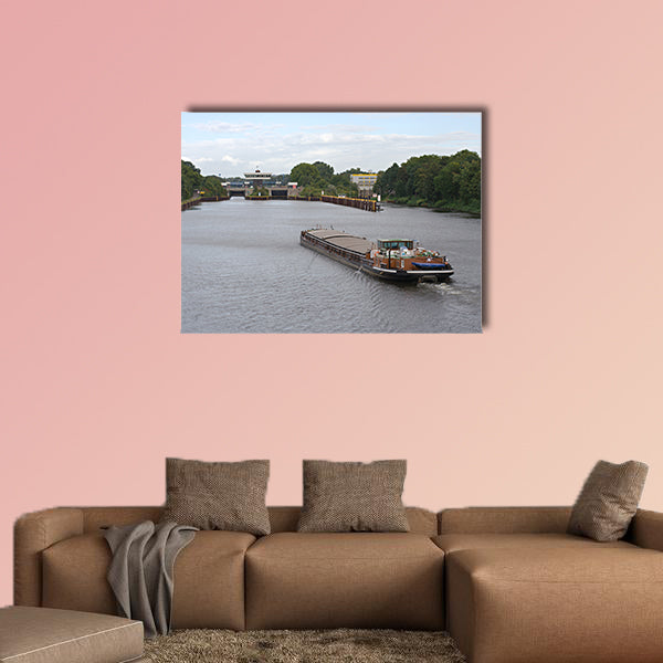 A barge on a canal moving towards a canal lock multi panel canvas wall art