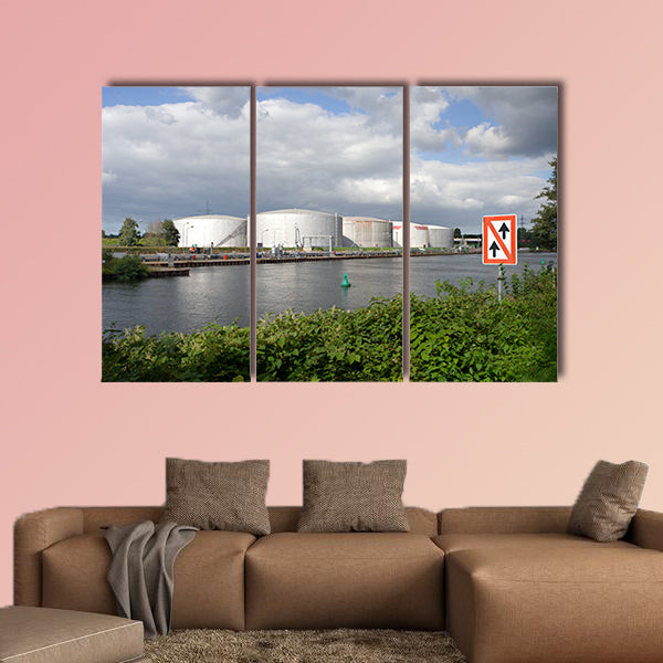 An oil port at a canal in Germany multi panel canvas wall art