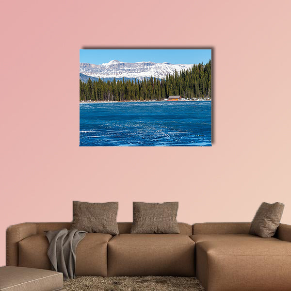 Boathouse next to half frozen lake Louise Banff , Alberta, Canada. wall art