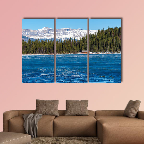 Boathouse next to half frozen lake Louise Banff , Alberta, Canada. wall art