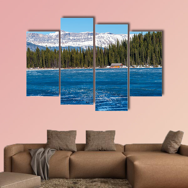 Boathouse next to half frozen lake Louise Banff , Alberta, Canada. wall art