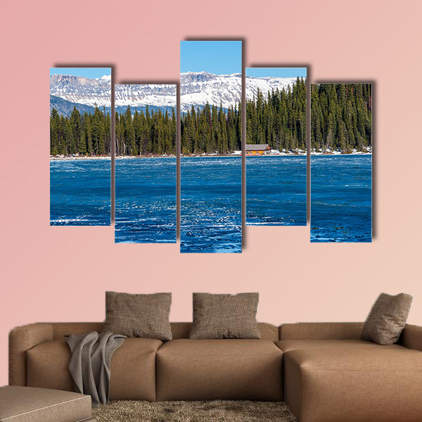 Boathouse next to half frozen lake Louise Banff , Alberta, Canada. wall art