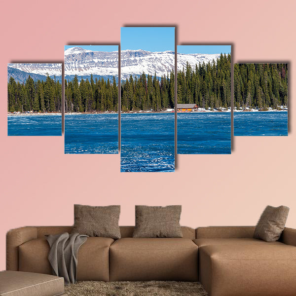 Boathouse next to half frozen lake Louise Banff , Alberta, Canada. wall art