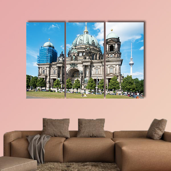 People at the Lustgarten Park in Berlin, Germany, in front of the Berliner wall art