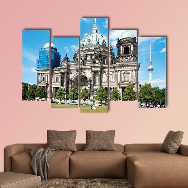 People at the Lustgarten Park in Berlin, Germany, in front of the Berliner wall art