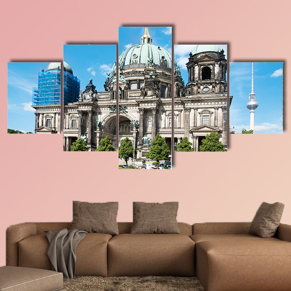 People at the Lustgarten Park in Berlin, Germany, in front of the Berliner wall art