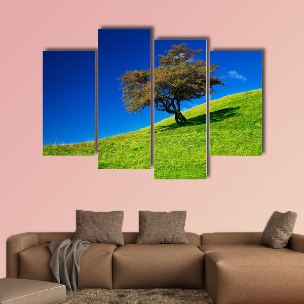 Landscape with a single tree on a meadow multi panel canvas wall art