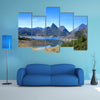 Beautiful mountain landscape with small lake in Spain multi panel canvas wall art