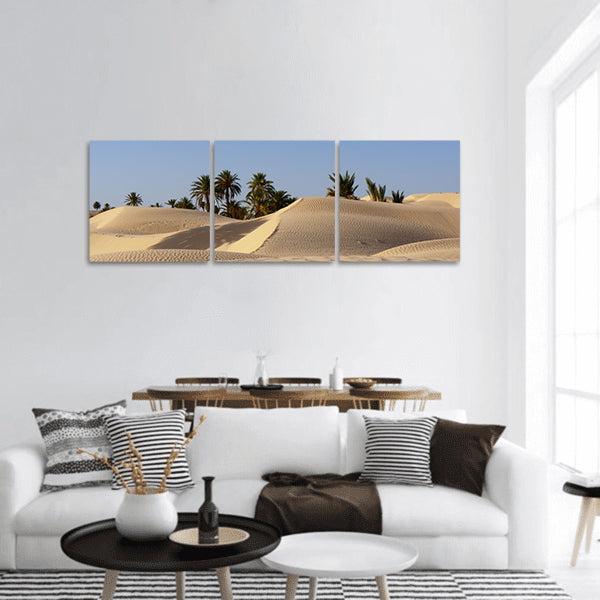 Sand dune and palm tree in the desert panoramic canvas wall art