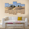 sand dune and palm tree in the desert Multi panel canvas wall art