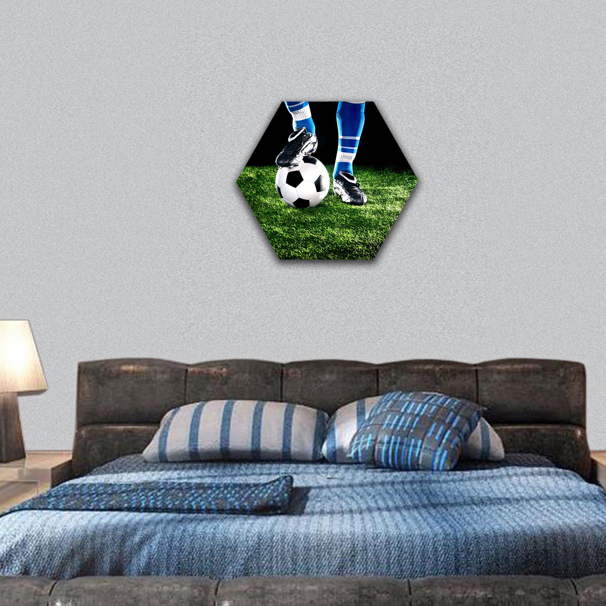 soccer ball with his feet on the football field hexagonal canvas wall art