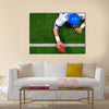 Photo of an American football player making a one handed touchdown Multi panel canvas wall art