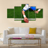 Photo of an American football player making a one handed touchdown Multi panel canvas wall art