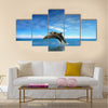 Two Beautiful Dolphins jumping on sea multi panel canvas wall art