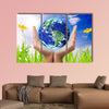 Hand holding earth, saving earth concept, multi panel canvas wall art