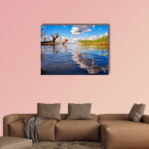 Beautiful forest with clouds reflecting on calm lake shore wall art