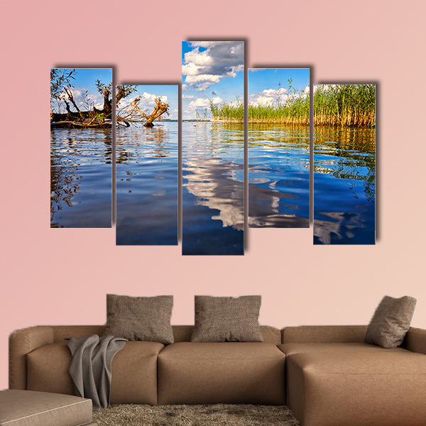 Beautiful forest with clouds reflecting on calm lake shore wall art