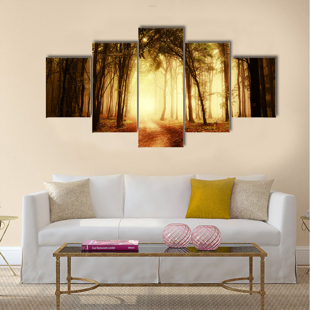 road through a golden forest at autumn multi panel canvas wall art