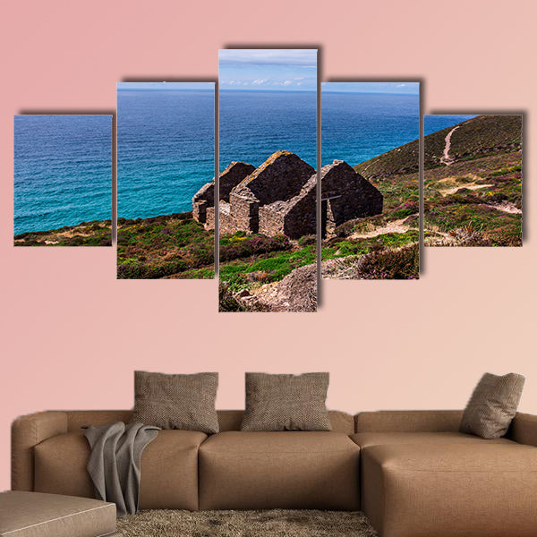 Stamps and wheel engine house ruins Wheal Coates mine on cliffs near