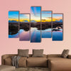 Coral reef emerges from the water at a reduced water level multi panel canvas wall art