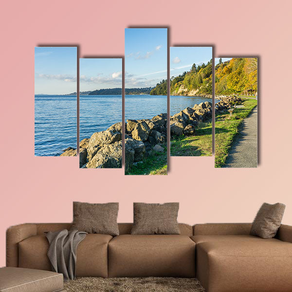 A view of the rocky shoreline at Saltwater State Park in the autumn multi panel canvas wall art